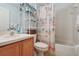 Charming bathroom features a shower-tub combo, vanity, and decorative details, providing a refreshing experience at 149 Southern Breeze Dr, Minneola, FL 34715