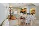 Dining area showing the access to the kitchen and breakfast bar at 149 Southern Breeze Dr, Minneola, FL 34715