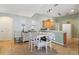 Dining area with charming table setting and views into the adjacent kitchen at 149 Southern Breeze Dr, Minneola, FL 34715