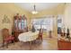 Bright dining room with a china cabinet, tile floors and natural light at 149 Southern Breeze Dr, Minneola, FL 34715