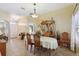 Inviting dining room with neutral colors, a china cabinet and natural light at 149 Southern Breeze Dr, Minneola, FL 34715