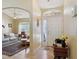 Bright foyer with tile flooring, decorative accents, and an arched doorway to the living room at 149 Southern Breeze Dr, Minneola, FL 34715