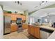 Modern kitchen with stainless steel appliances and wood cabinets at 149 Southern Breeze Dr, Minneola, FL 34715