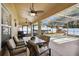 Enclosed lanai with outdoor seating and dining area, overlooking the pool and boat at 149 Southern Breeze Dr, Minneola, FL 34715