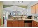 Bright living room visible from kitchen showcases high ceilings and sliding glass doors to the outdoor area at 149 Southern Breeze Dr, Minneola, FL 34715