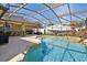 Beautiful pool featuring a hot tub, and a screened enclosure for comfortable outdoor living at 149 Southern Breeze Dr, Minneola, FL 34715