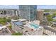 Aerial view of building featuring rooftop pool and sports facilities with city views at 150 E Robinson St # 1219, Orlando, FL 32801