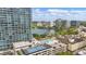 City view showcasing rooftop pool, sports court and manicured landscaping near the lake at 150 E Robinson St # 1219, Orlando, FL 32801