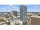 Elevated view of building showing cityscape, rooftop pool, and recreational court at 150 E Robinson St # 1219, Orlando, FL 32801