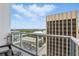 Enjoy city views from this condo's private balcony with glass railings and stylish outdoor seating at 150 E Robinson St # 1219, Orlando, FL 32801