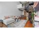 Bright, open living space with spiral staircase, hardwood floors, dining area and comfortable seating at 150 E Robinson St # 1219, Orlando, FL 32801
