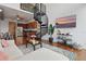 Bright open-concept living area featuring a spiral staircase, adjacent to an efficient, modern kitchen at 150 E Robinson St # 1219, Orlando, FL 32801