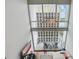 Bright living room with spiral staircase, hardwood floors, stylish rug, comfortable sofa, and large windows at 150 E Robinson St # 1219, Orlando, FL 32801