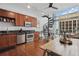 Bright, open floor plan connecting the kitchen, dining, and living area with spiral staircase and views at 150 E Robinson St # 1219, Orlando, FL 32801