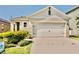 Charming one-story home with a two-car garage and well-maintained landscaping at 156 Eagleview Loop, Davenport, FL 33837
