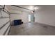 Spacious two car garage with a modern door and plenty of storage space for vehicles and projects at 156 Eagleview Loop, Davenport, FL 33837