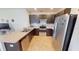 Modern kitchen featuring stainless steel appliances, tile backsplash, and ample counter space at 156 Eagleview Loop, Davenport, FL 33837