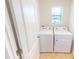 Laundry room features a window and standard washer and dryer at 156 Eagleview Loop, Davenport, FL 33837