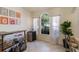 Bar area complete with bar, mini refrigerator, and artistic decor at 1563 Song Sparrow Ct, Sanford, FL 32773