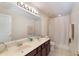 Large bathroom features double vanity and shower curtain at 1563 Song Sparrow Ct, Sanford, FL 32773