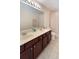 Bright bathroom features double vanity and tile floor at 1563 Song Sparrow Ct, Sanford, FL 32773