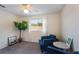 Well-lit bedroom with plush carpeting, complemented by modern decor and furniture at 1563 Song Sparrow Ct, Sanford, FL 32773