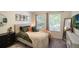 Well-lit bedroom featuring stylish decor, neutral tones, and comfortable furnishings at 1563 Song Sparrow Ct, Sanford, FL 32773