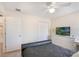 Bedroom featuring a dark bed, white dresser, carpet flooring, and natural light from the window at 1563 Song Sparrow Ct, Sanford, FL 32773