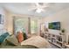 Bright bedroom with ample natural light, modern decor, and comfortable sleeping space at 1563 Song Sparrow Ct, Sanford, FL 32773