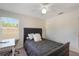 Cozy bedroom with natural light, a comfortable bed, and a dedicated workspace at 1563 Song Sparrow Ct, Sanford, FL 32773