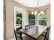 Dining room with ample natural light, chandelier lighting, and a door to the backyard at 1563 Song Sparrow Ct, Sanford, FL 32773