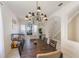 Formal dining room with pendant lighting, wainscotting, and decorative furniture at 1563 Song Sparrow Ct, Sanford, FL 32773