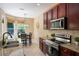 Charming kitchen featuring stainless steel appliances, tile backsplash, and natural light at 1563 Song Sparrow Ct, Sanford, FL 32773