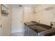 Laundry room with washer, dryer, and white door at 1563 Song Sparrow Ct, Sanford, FL 32773