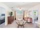 Comfortable living room with plush seating, a TV, and a view to a bedroom at 1563 Song Sparrow Ct, Sanford, FL 32773
