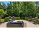 Relaxing outdoor patio area with comfortable seating and lush greenery at 1563 Song Sparrow Ct, Sanford, FL 32773