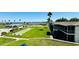 Exterior view showcasing pool, shuffleboard, lake, and beautiful landscaping, highlighting the community's appeal at 1600 W Lake Parker Dr # C24, Lakeland, FL 33805