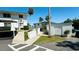 The exterior of the property is shown with trees and a ramp at 1600 W Lake Parker Dr # C24, Lakeland, FL 33805