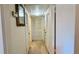 Bright hallway featuring mirrored wall decor, neutral carpet and closet at 1600 W Lake Parker Dr # C24, Lakeland, FL 33805