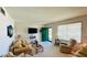 Cozy living room featuring comfortable seating, large window, and stylish decor, creating a welcoming atmosphere at 1600 W Lake Parker Dr # C24, Lakeland, FL 33805