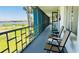 Screened-in patio offers scenic views, furnished with comfortable seating for relaxation and enjoying the landscape at 1600 W Lake Parker Dr # C24, Lakeland, FL 33805
