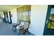 Screened-in patio with comfortable seating, providing a cozy space for enjoying outdoor views and relaxation at 1600 W Lake Parker Dr # C24, Lakeland, FL 33805