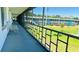 Outdoor walkway offers a serene view of the community's manicured green space, blending nature with architecture at 1600 W Lake Parker Dr # C24, Lakeland, FL 33805