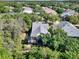 Aerial view of the property, highlighting the screened lanai and wooded surroundings at 1626 Victoria Gardens Drive, Deland, FL 32724