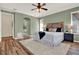 Primary bedroom with arched doorway to a bathroom featuring en-suite with luxurious amenities at 1626 Victoria Gardens Drive, Deland, FL 32724