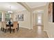 Elegant dining room with a chandelier, stylish table setting, and neutral paint, perfect for entertaining guests at 1626 Victoria Gardens Drive, Deland, FL 32724