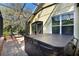 Inviting outdoor space with a covered hot tub and access to a serene screened patio at 1626 Victoria Gardens Drive, Deland, FL 32724