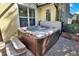 Enjoy a relaxing hot tub on the brick-paved patio, perfect for unwinding in your outdoor retreat at 1626 Victoria Gardens Drive, Deland, FL 32724