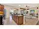 Open kitchen and living room area with a large island, perfect for entertaining and Gathering gatherings at 1626 Victoria Gardens Drive, Deland, FL 32724