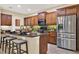 Gourmet kitchen with stainless steel appliances, island seating and ample storage and counter space at 1626 Victoria Gardens Drive, Deland, FL 32724